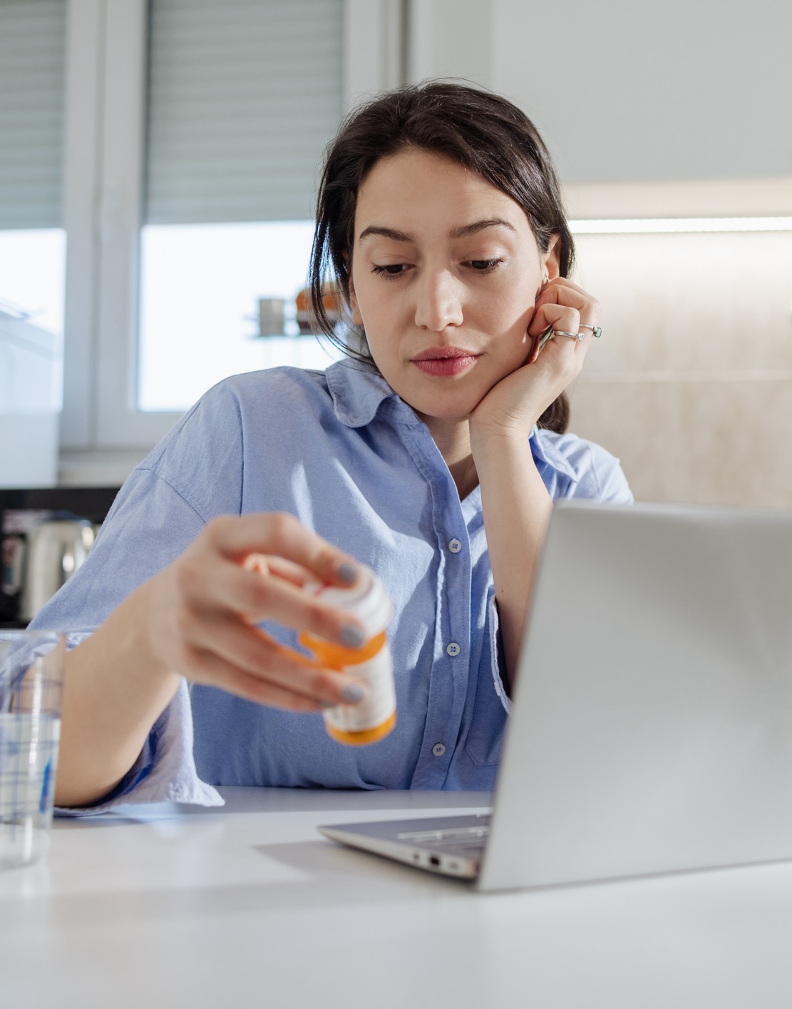 Young worried woman is reading information’s about medicine on the internet